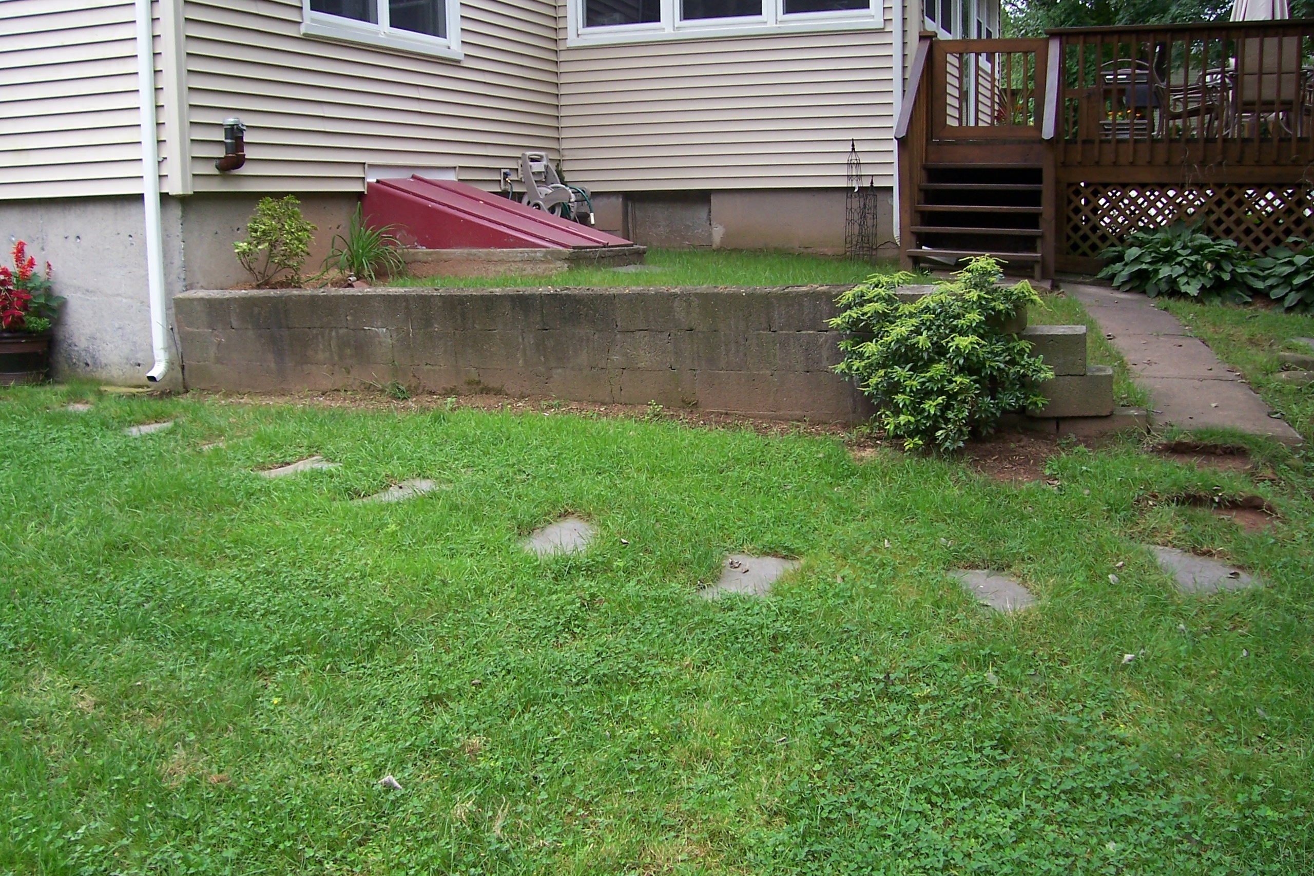Retaining Wall Along a Driveway | Country Landscaping, LLC